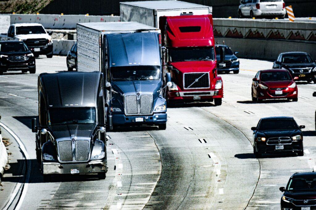 Photo by David Brown: https://www.pexels.com/photo/trucks-and-cars-on-a-highway-16325212/